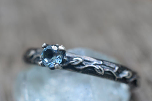 Sky Blue Topaz Engagement Ring With Vine Leaf Pattern