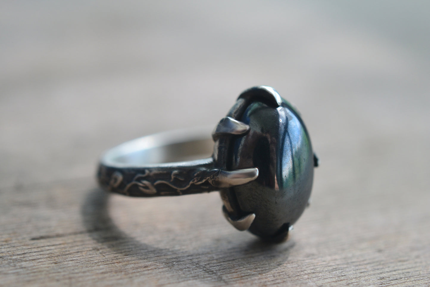 Oval Hematite Cabochon Ring With Elven Leaf Pattern