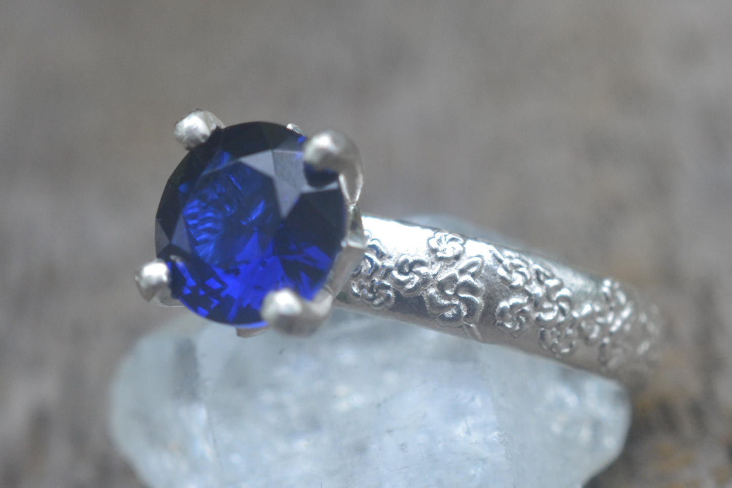 Faceted Blue Sapphire Ring with Blossom Design