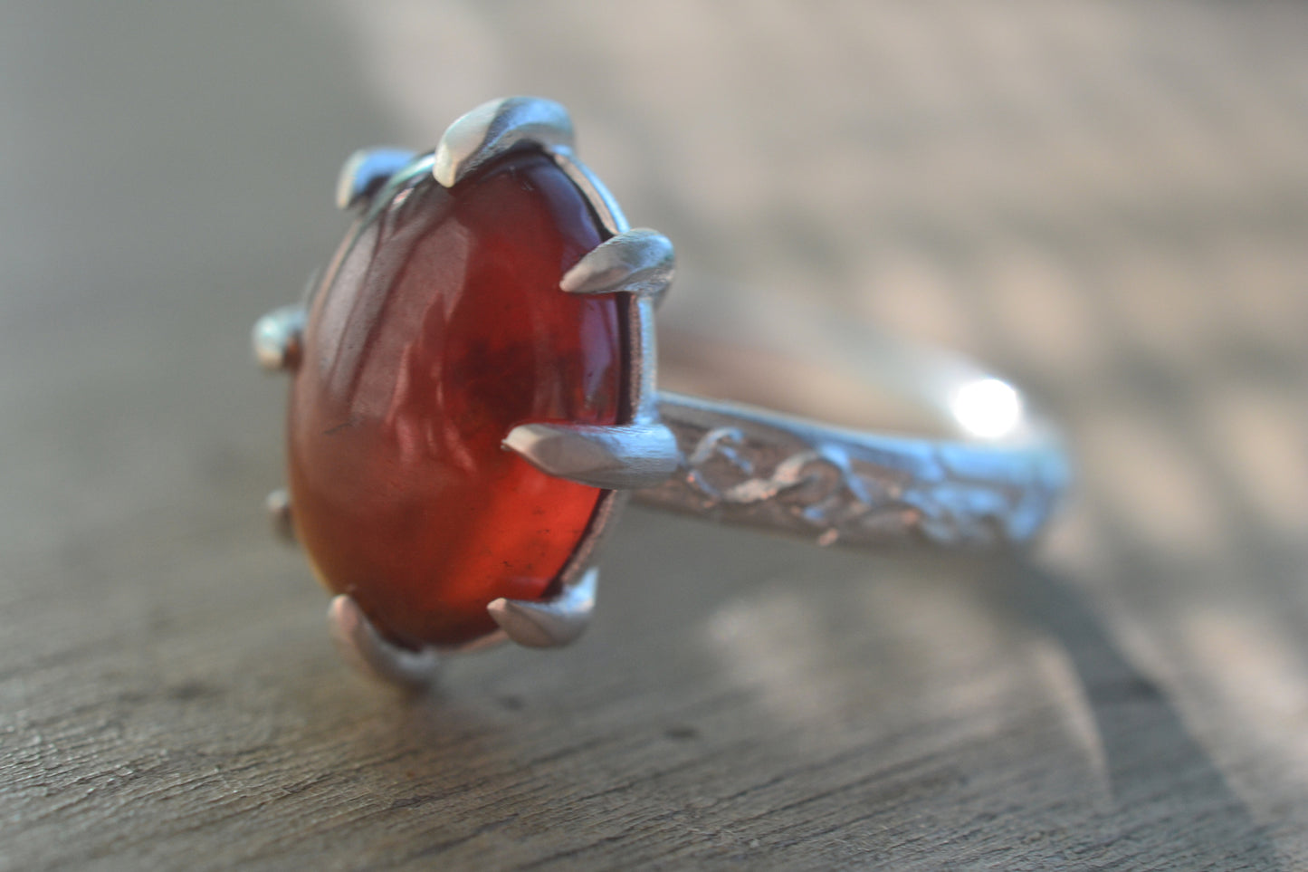 Oval Hessonite Garnet Cabochon Ring With Leaf Band