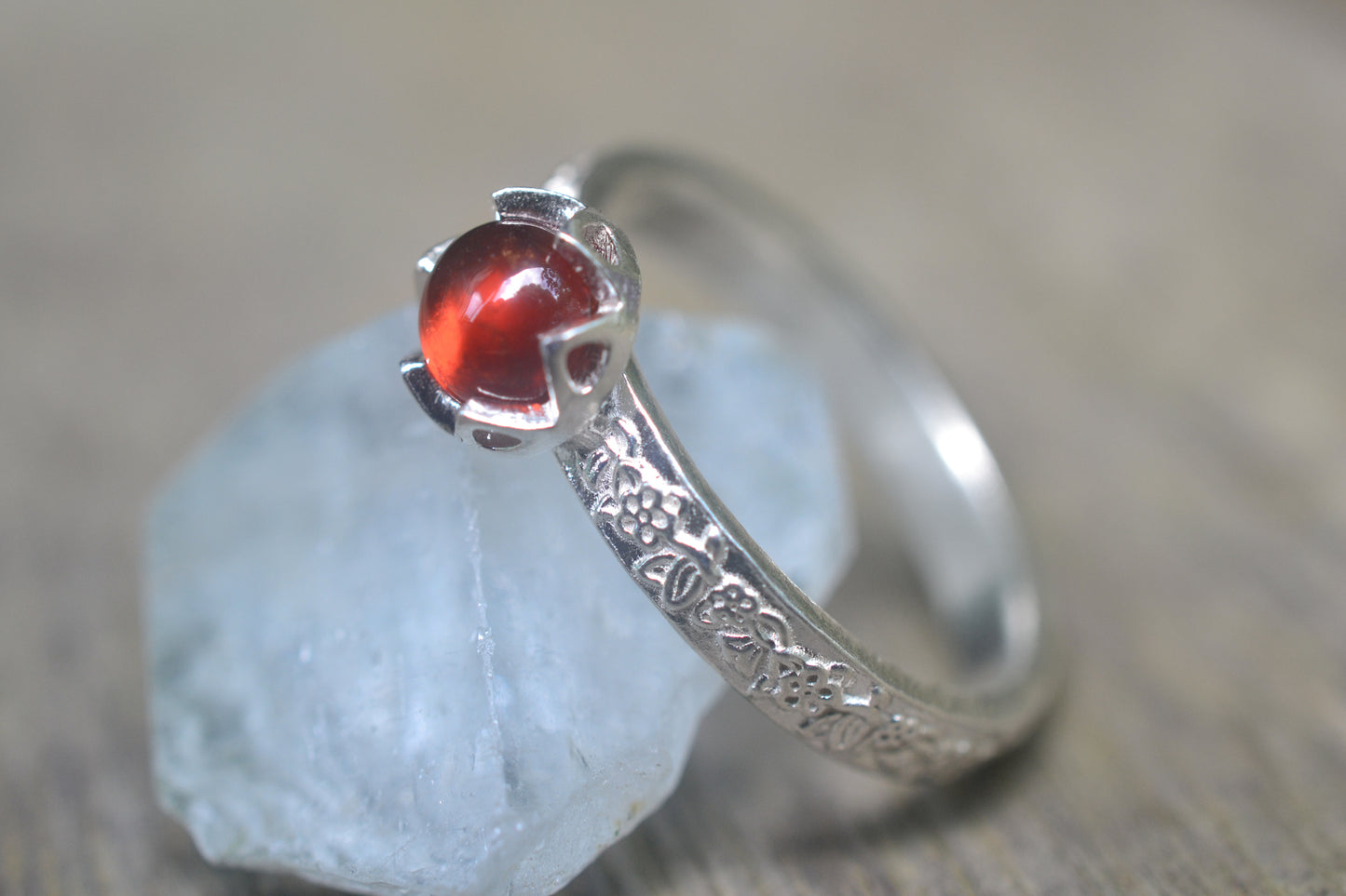 Bezel Set Garnet Ring With Rose Leaf Design