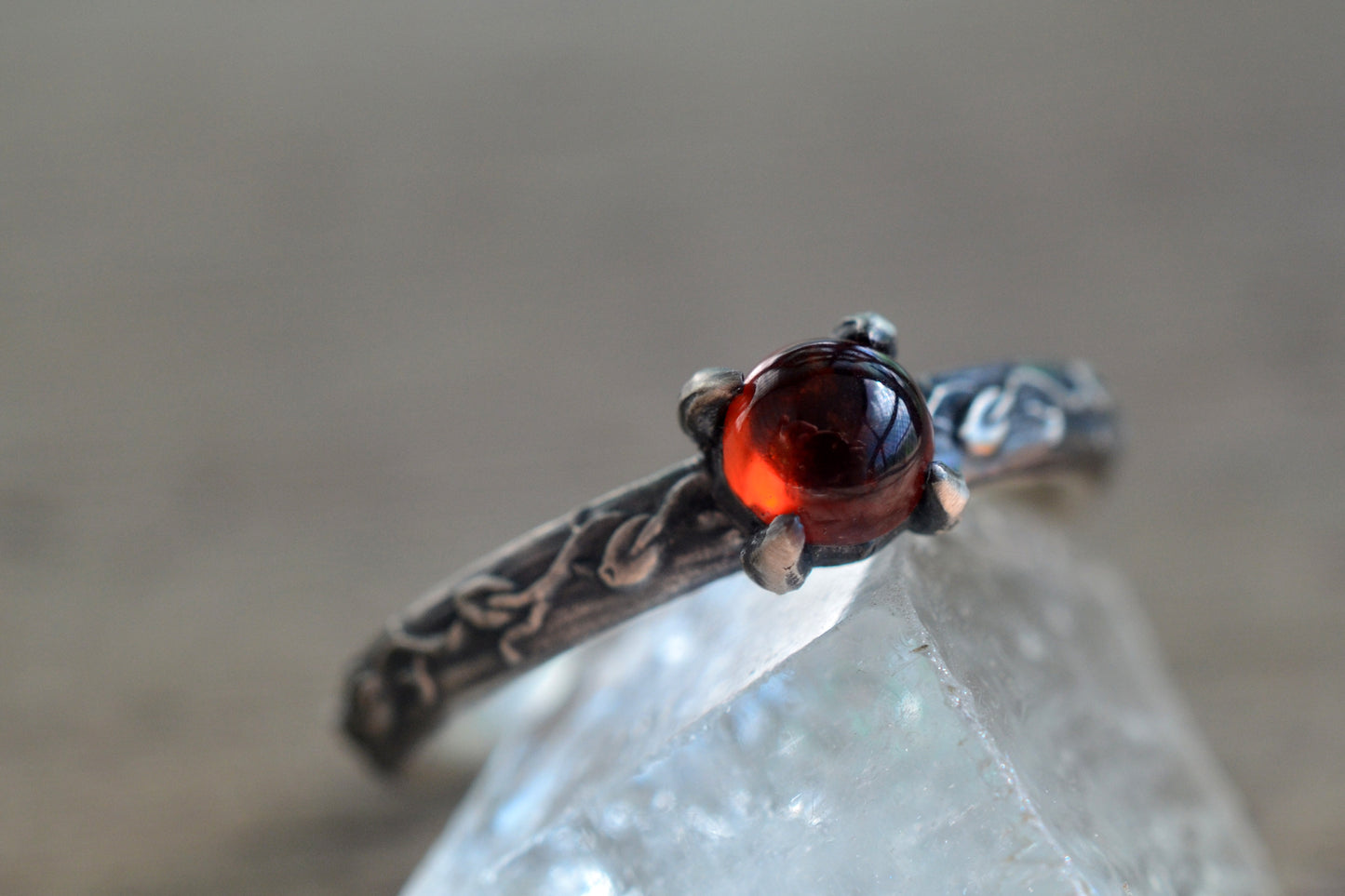 Silver leaf engagement ring with garnet