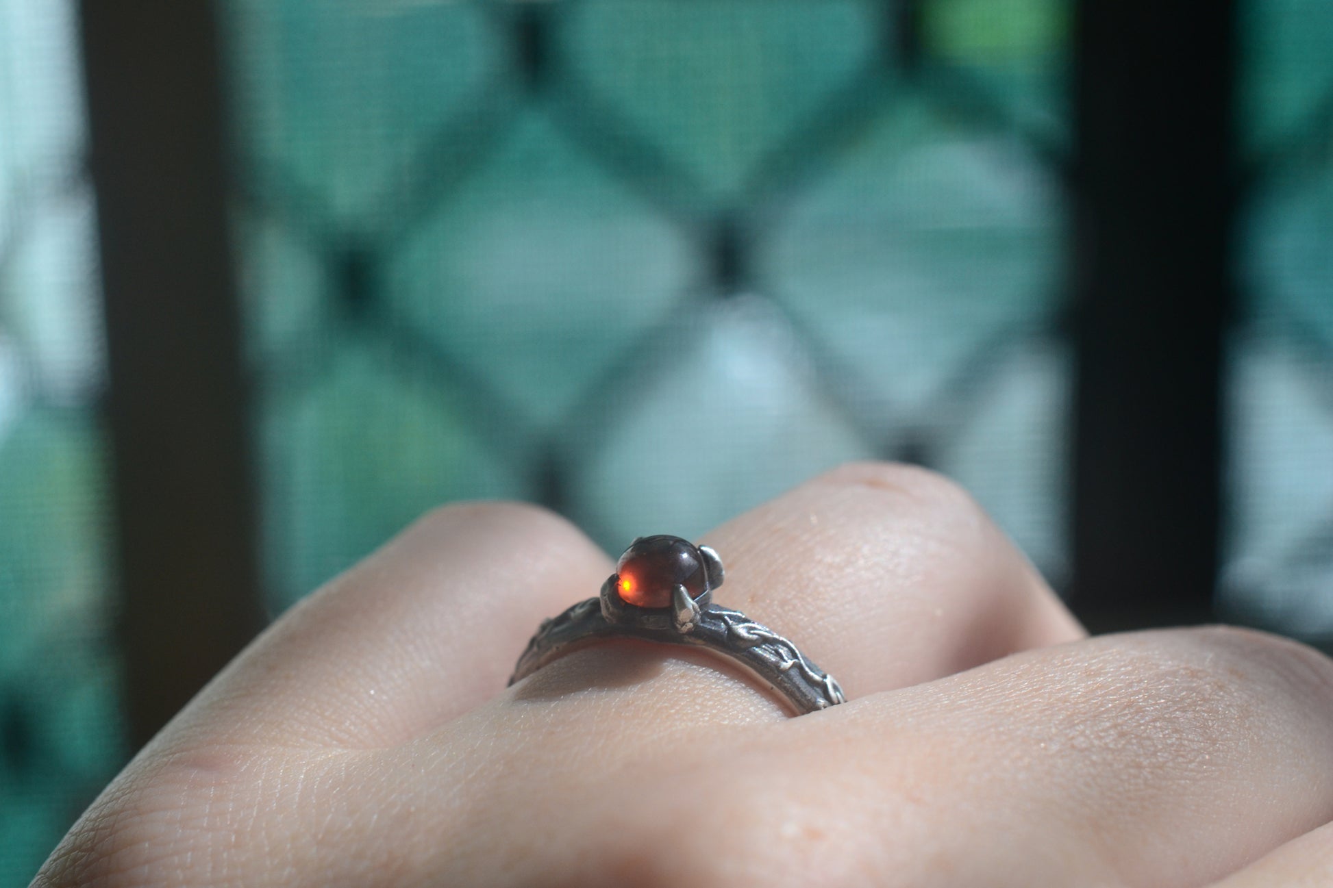garnet cabochon engagement ring in 925 silver